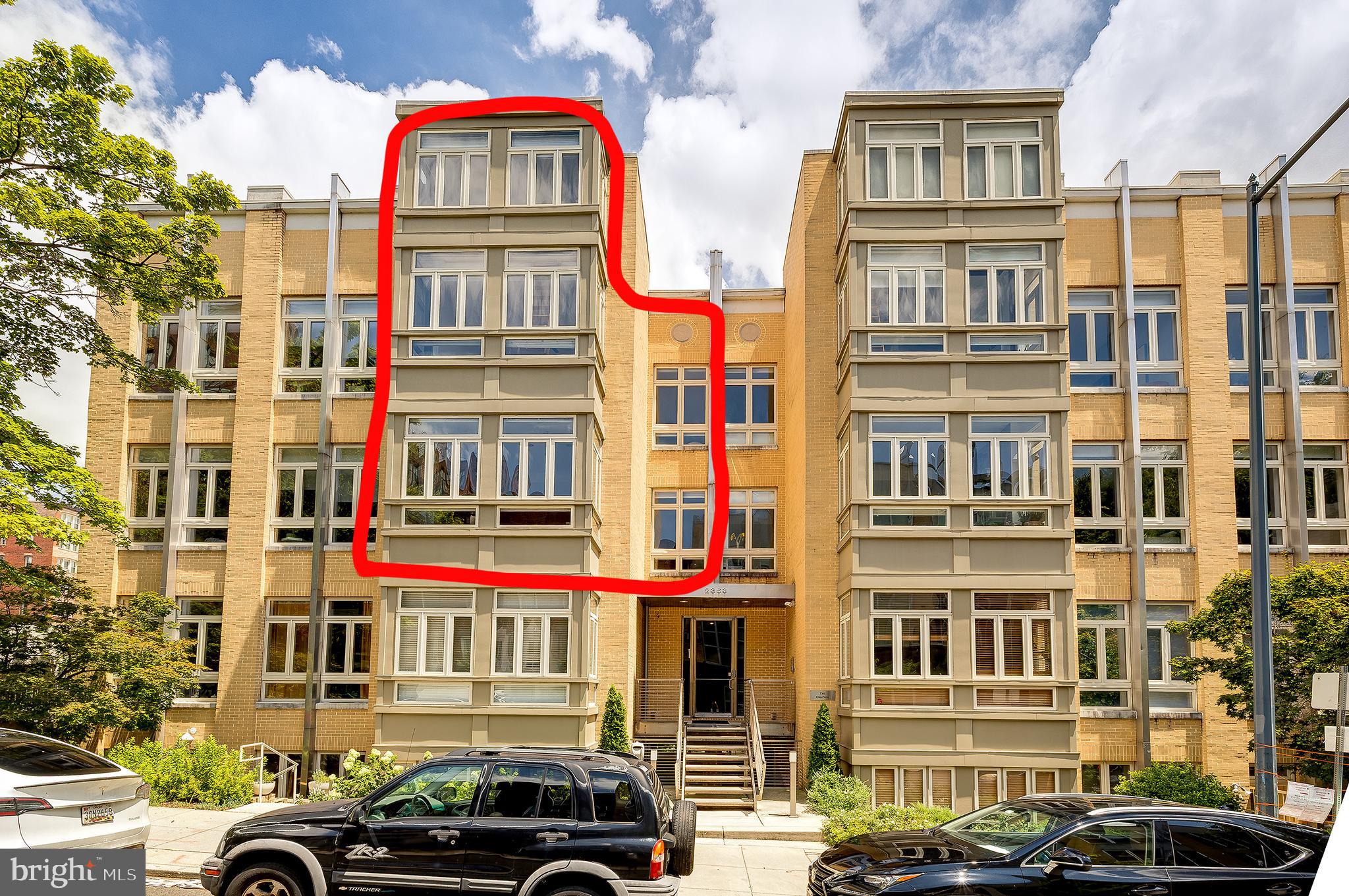 2363 Champlain Street Northwest, Unit 20 Washington, DC 20009 - Photo 25 of 29 a front view of a large building with a street
