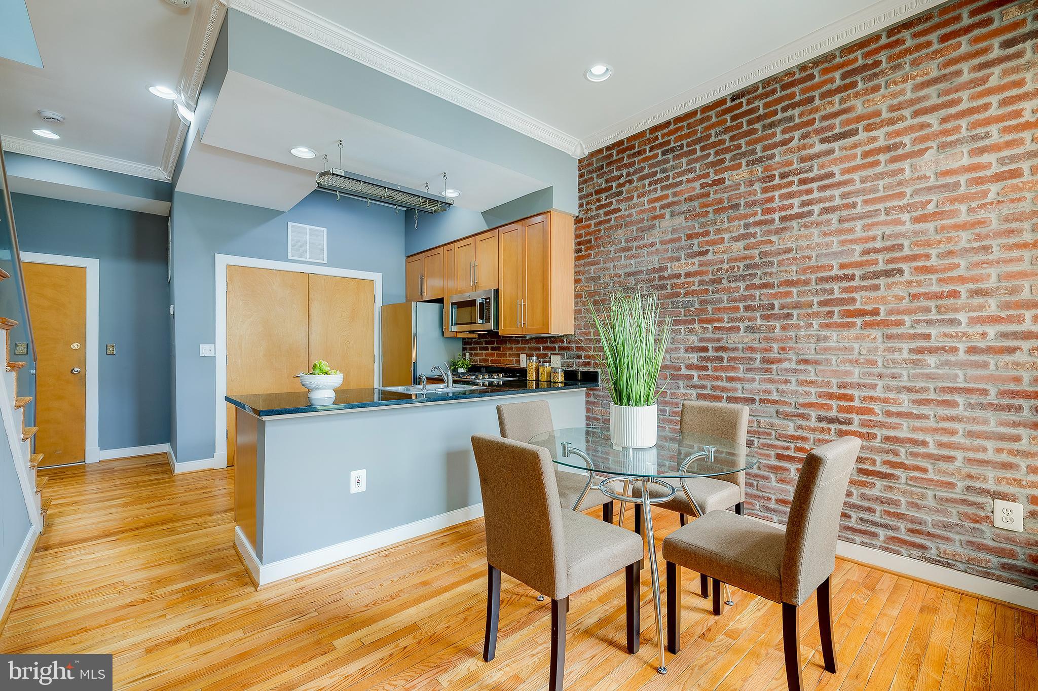 2363 Champlain Street Northwest, Unit 20 Washington, DC 20009 - Photo 5 of 29 a dining room with furniture and wooden floor