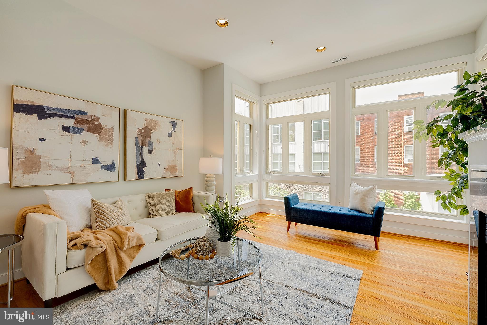 2363 Champlain Street Northwest, Unit 20 Washington, DC 20009 - Photo 7 of 29 a living room with furniture and a large window