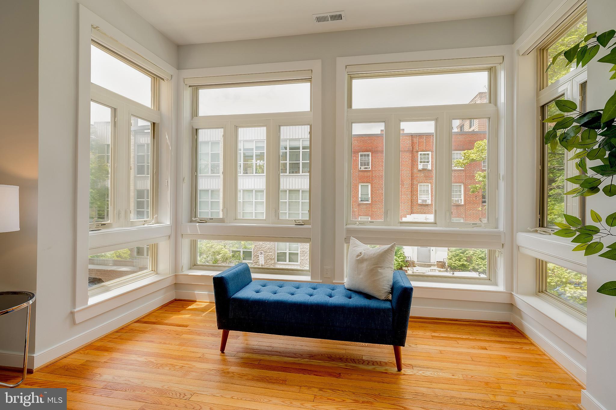 2363 Champlain Street Northwest, Unit 20 Washington, DC 20009 - Photo 8 of 29 a living room filled with furniture and a wooden floor