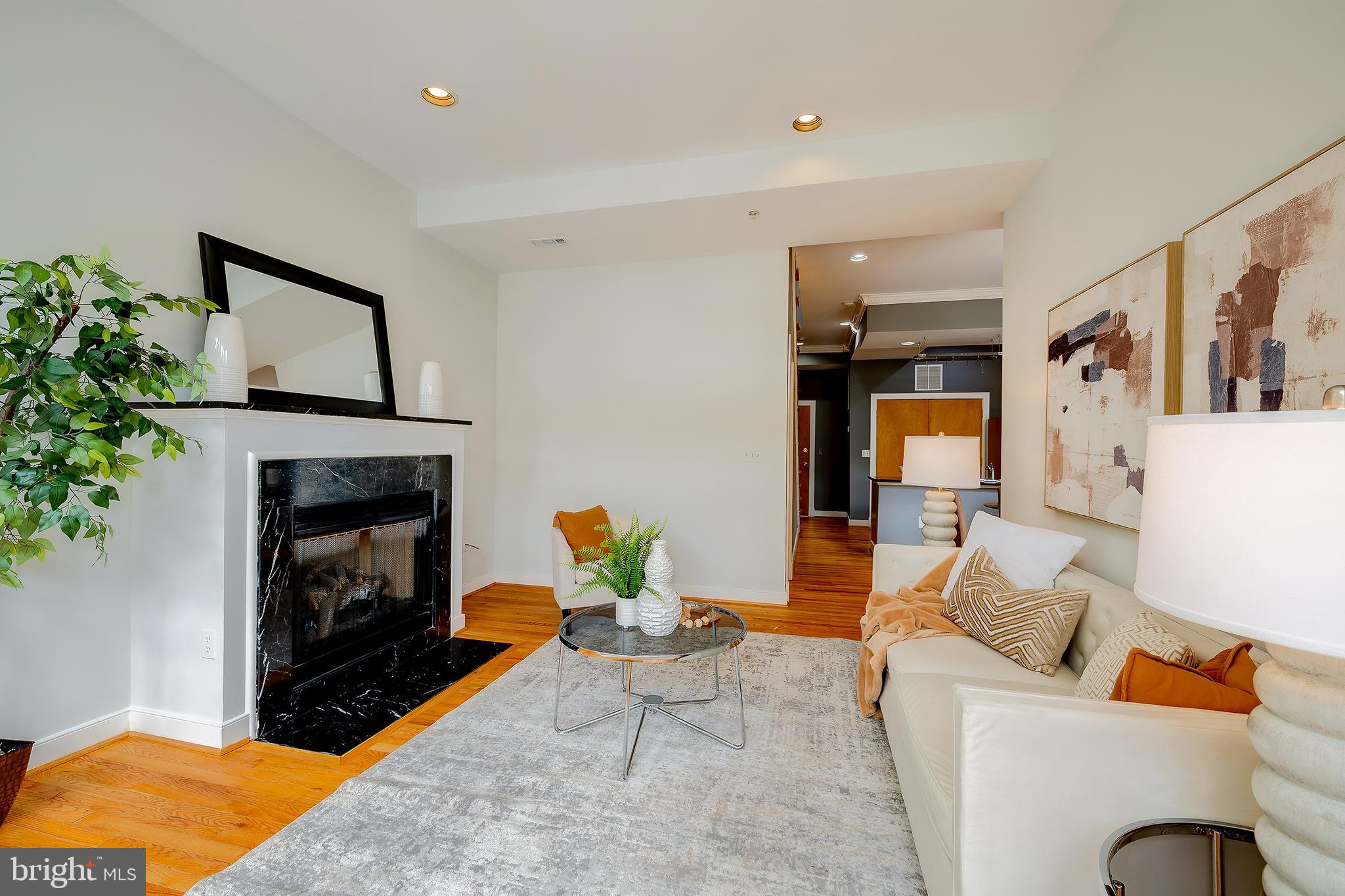 2363 Champlain Street Northwest, Unit 20 Washington, DC 20009 - Photo 10 of 29 a living room with furniture and a fireplace