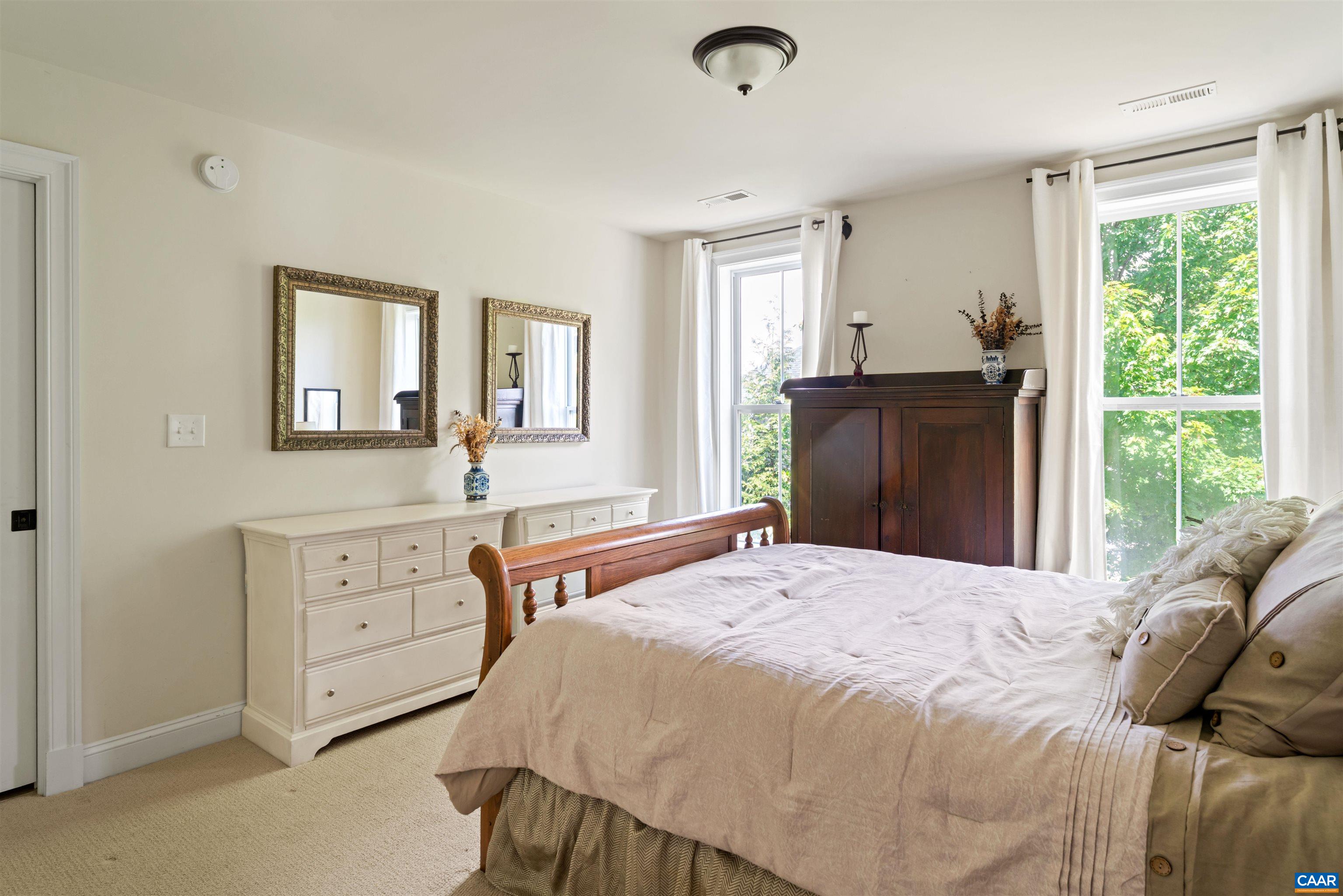 2246 Hyland Ridge Drive Charlottesville, VA 22911 - Photo 30 of 53 a bedroom with a bed and a dresser