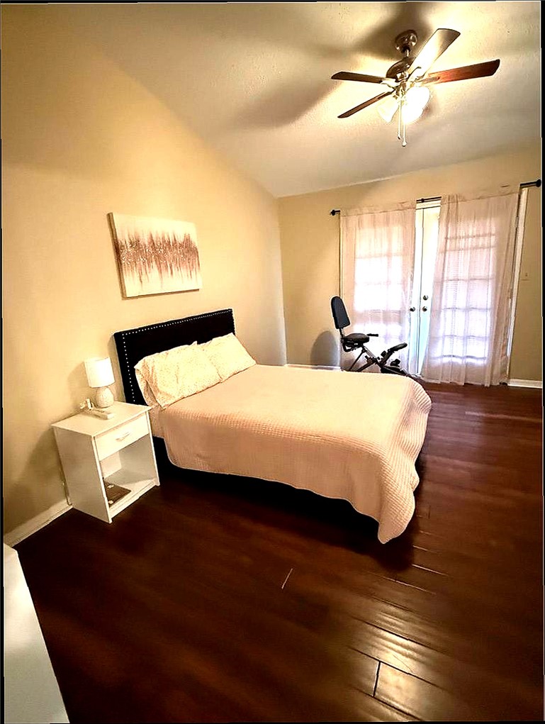 76 Club Road Dover, AR 72837 - Photo 15 of 36 Bedroom featuring wood finished floors, ceiling fan, and vaulted ceiling