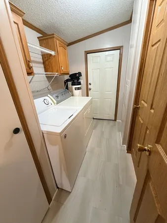 a view of utility room with a sink a washer and dryer