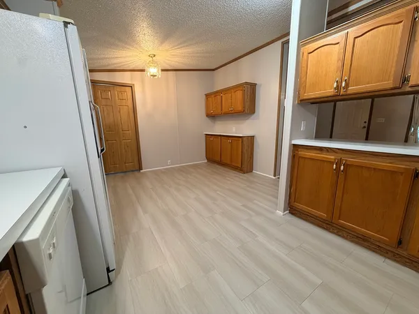 a view of a storage and utility room with washer and dryer