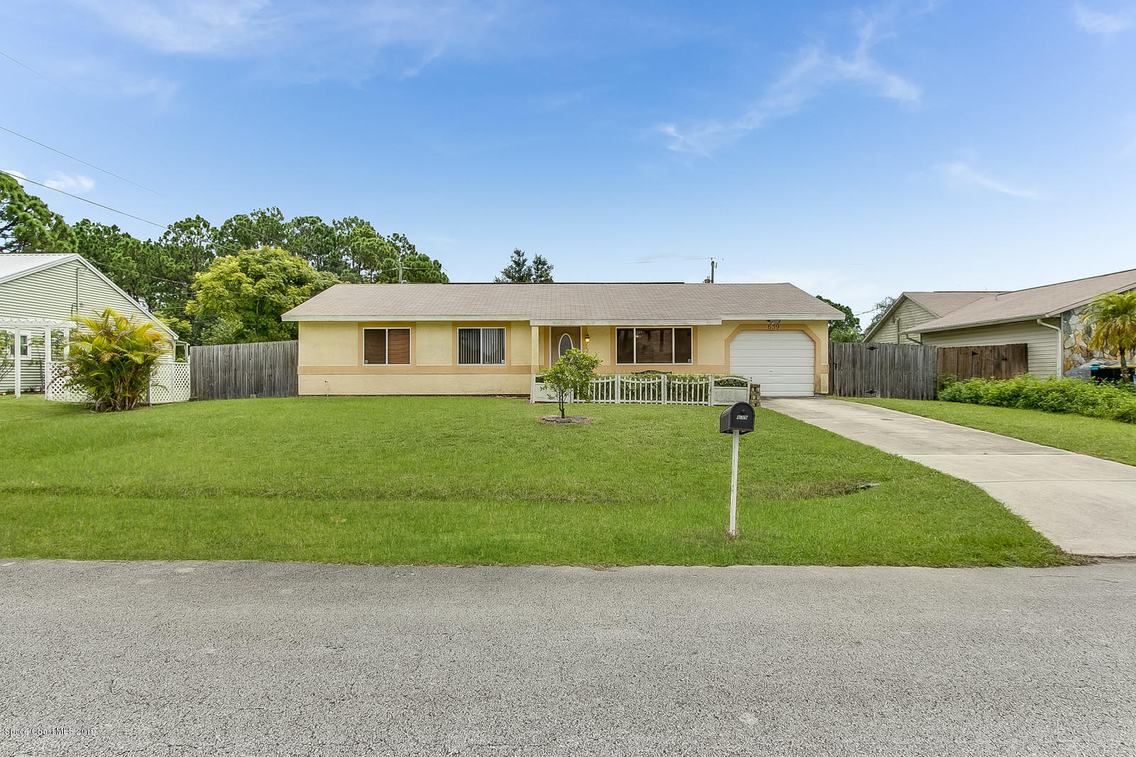 639 Furth Road Northwest Palm Bay, FL 32907 - Photo 1 of 22 a front view of house with yard