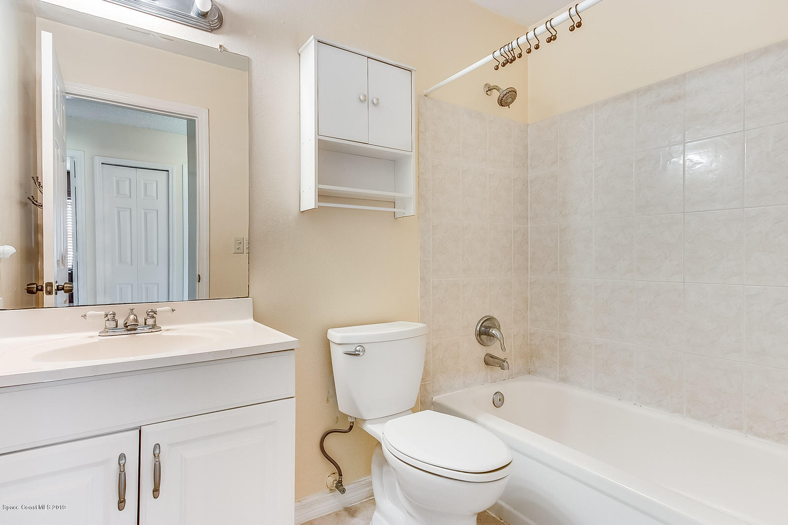 639 Furth Road Northwest Palm Bay, FL 32907 - Photo 18 of 22 a bathroom with a sink a toilet and shower