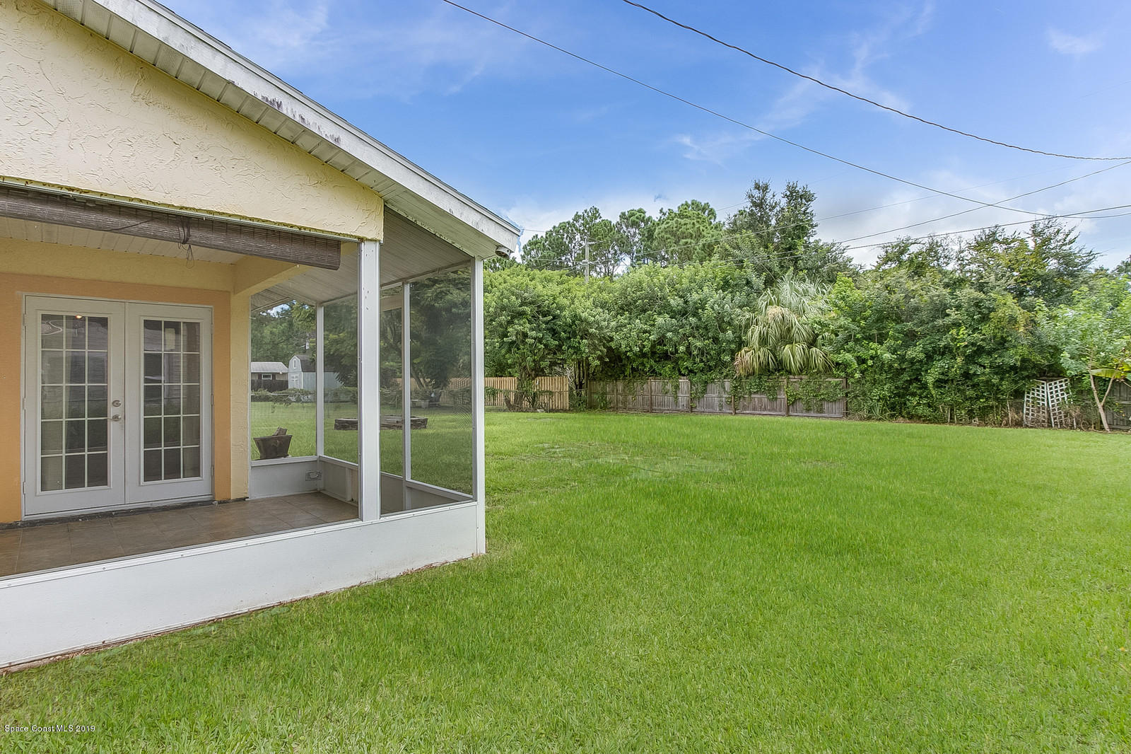 639 Furth Road Northwest Palm Bay, FL 32907 - Photo 3 of 22 a view of a house with backyard and porch