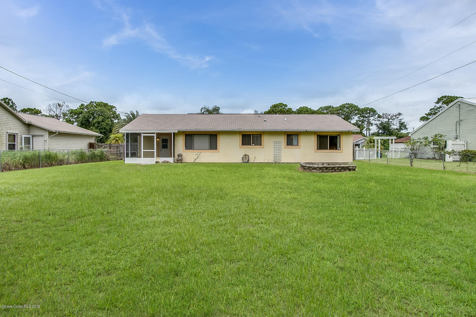639 Furth Road Northwest Palm Bay, FL 32907 - Photo 4 of 22 a front view of a house with a garden