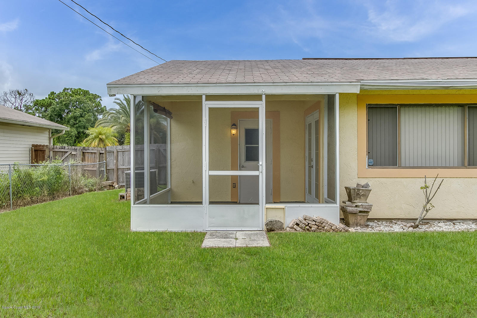 639 Furth Road Northwest Palm Bay, FL 32907 - Photo 6 of 22 front view of a house with a yard