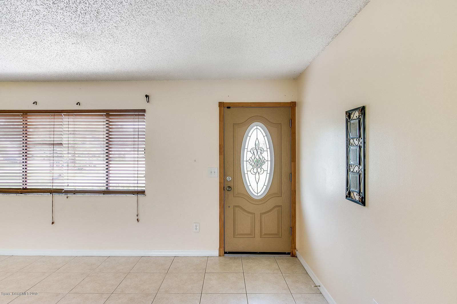 639 Furth Road Northwest Palm Bay, FL 32907 - Photo 8 of 22 a view of cabinets and wooden floor