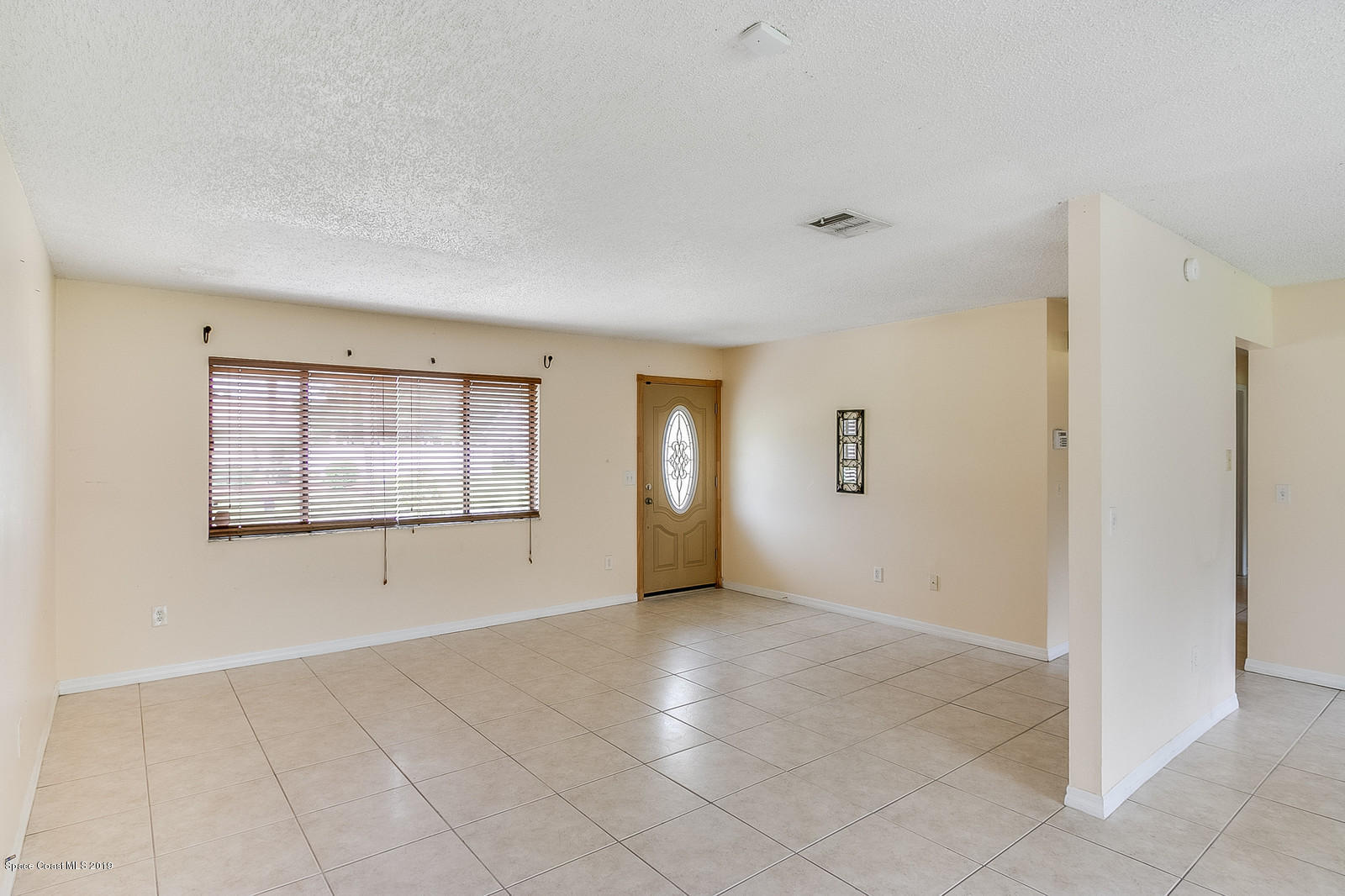 639 Furth Road Northwest Palm Bay, FL 32907 - Photo 9 of 22 a view of an empty room with a window