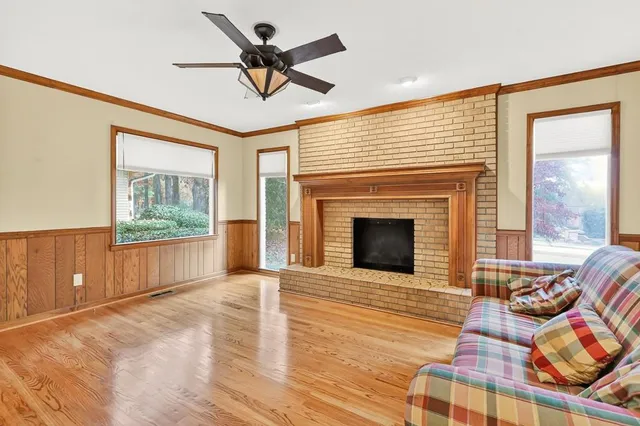 a living room with furniture and a fireplace
