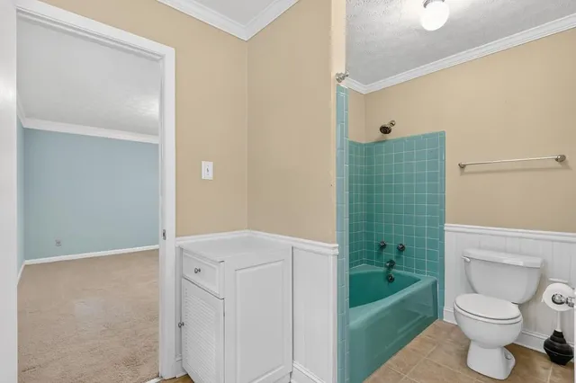 a bathroom with a sink a toilet and bathtub