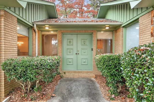 a view of a wooden door of the house