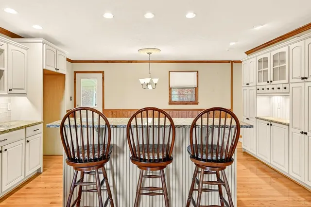 a view of a city from a balcony with furniture
