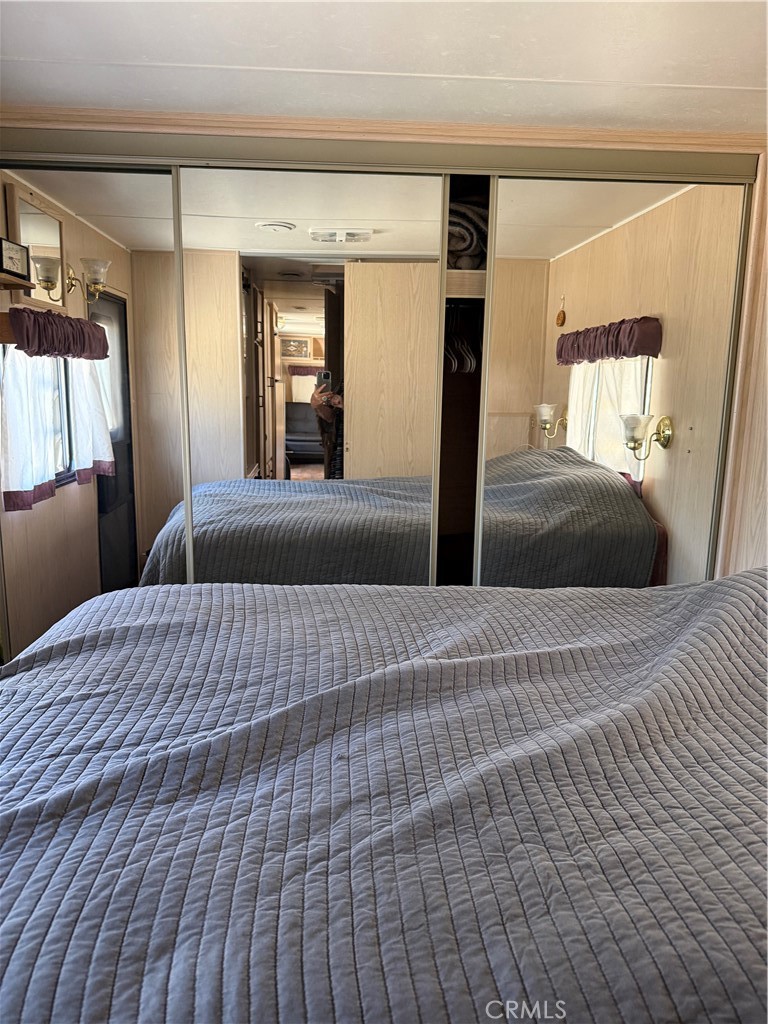 96484 Kennedy Meadow Road Inyokern, CA 93527 - Photo 38 of 42 a bedroom with a bed and window