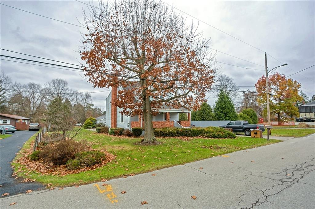 210 Cook Road Belle Vernon, PA 15012 - Photo 11 of 15 a front view of a house with garden and trees