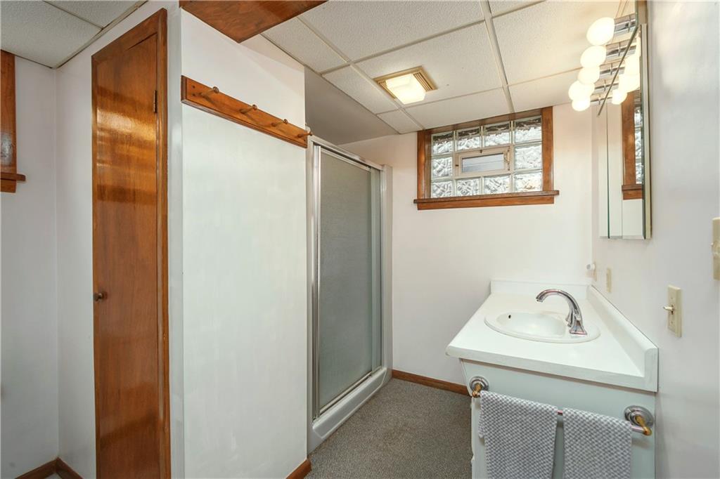 210 Cook Road Belle Vernon, PA 15012 - Photo 12 of 15 a bathroom with a sink and mirror