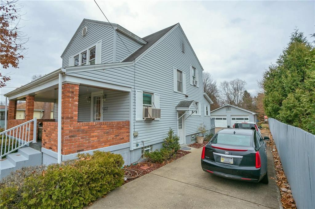 210 Cook Road Belle Vernon, PA 15012 - Photo 3 of 15 a car parked in front of a house