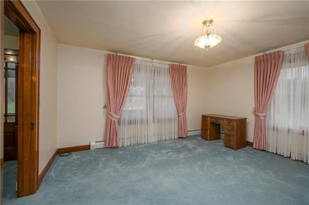 210 Cook Road Belle Vernon, PA 15012 - Photo 4 of 15 an empty room with closet and windows