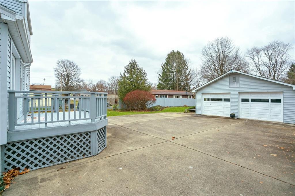 210 Cook Road Belle Vernon, PA 15012 - Photo 9 of 15 a view of a house with a yard and wooden fence
