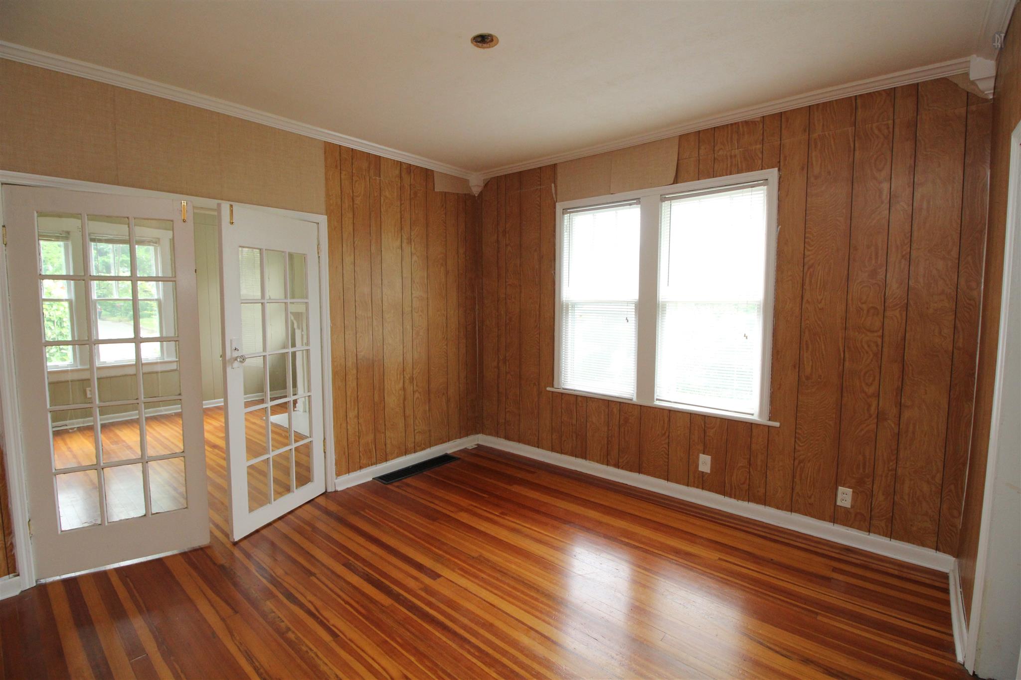 511 3rd Avenue West Springfield, TN 37172 - Photo 3 of 14 Dining room or office with french doors and lots of natural light from the large double window.