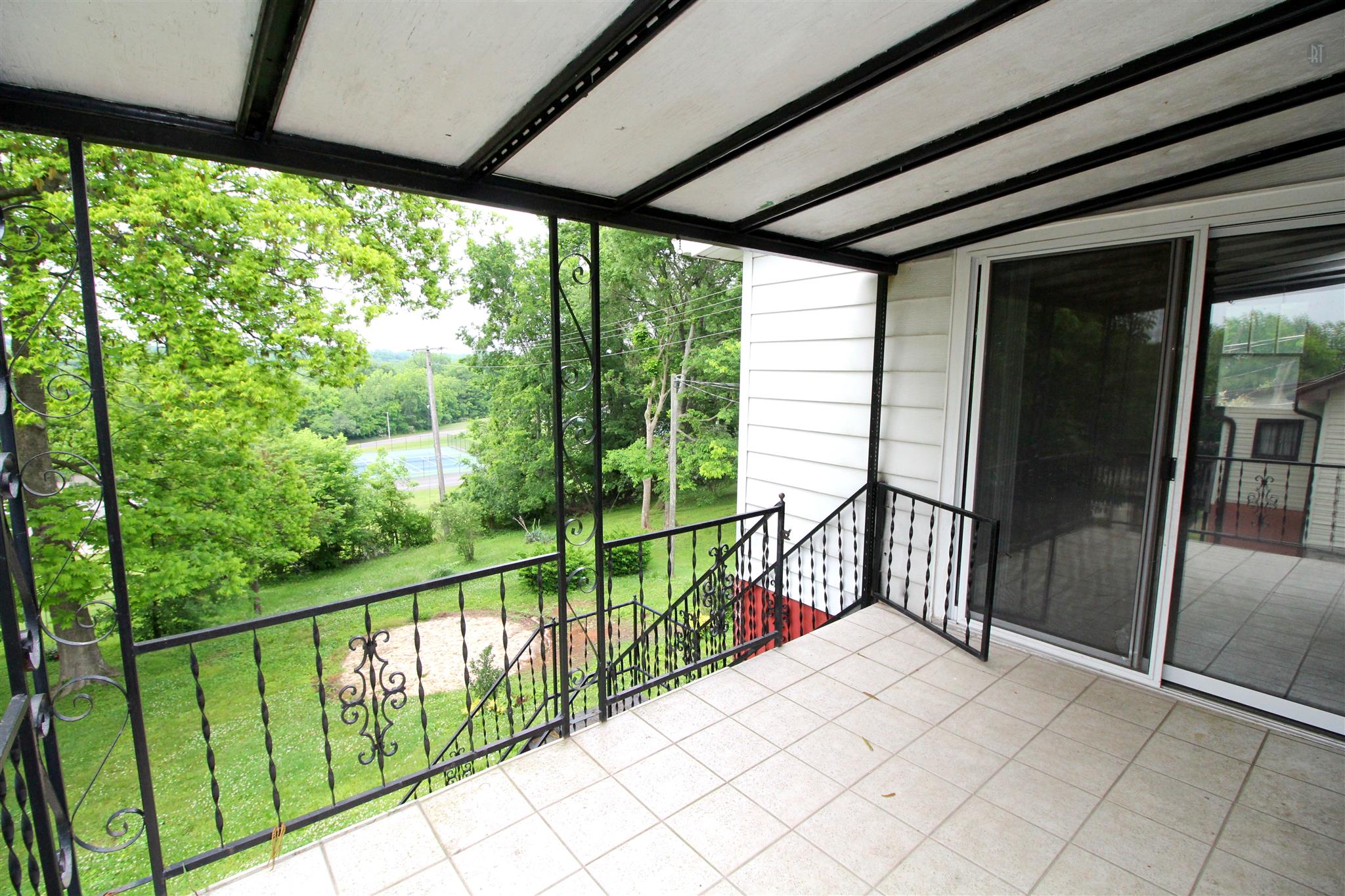 511 3rd Avenue West Springfield, TN 37172 - Photo 10 of 14 Covered back porch looks out over the tennis courts.