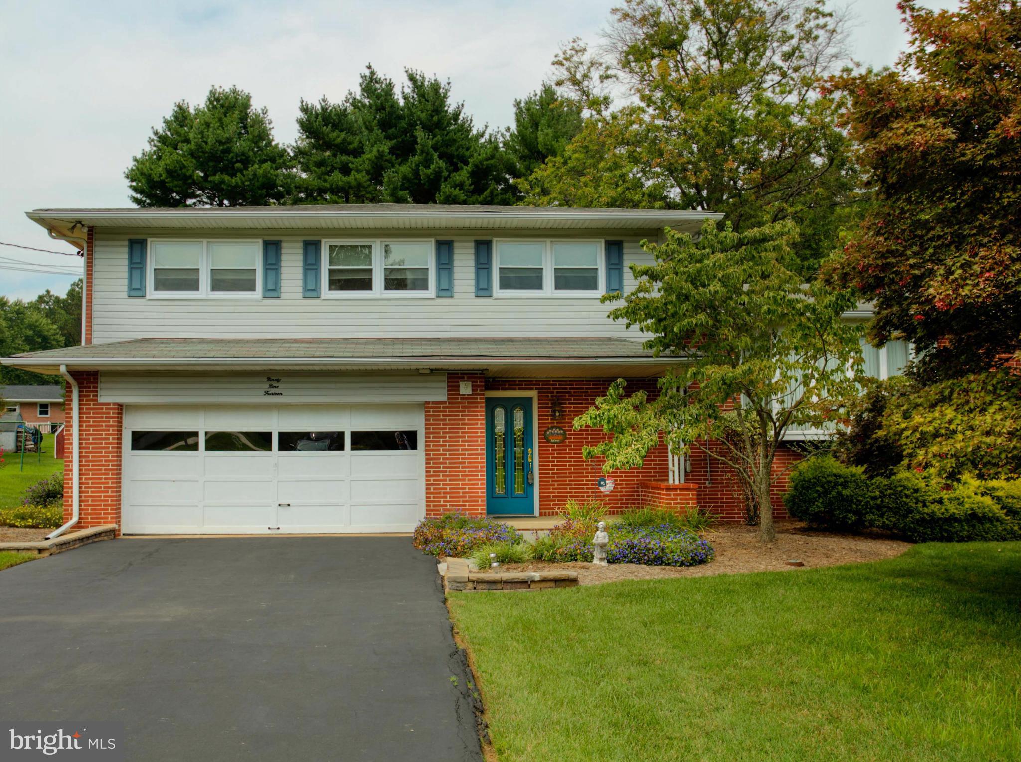 9914 Marilynn Road Perry Hall, MD 21128 - Photo 1 of 25 a front view of a house with a yard and garage