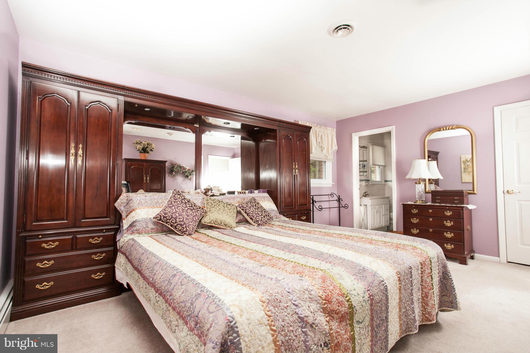 9914 Marilynn Road Perry Hall, MD 21128 - Photo 11 of 25 a bedroom with a bed and a dresser