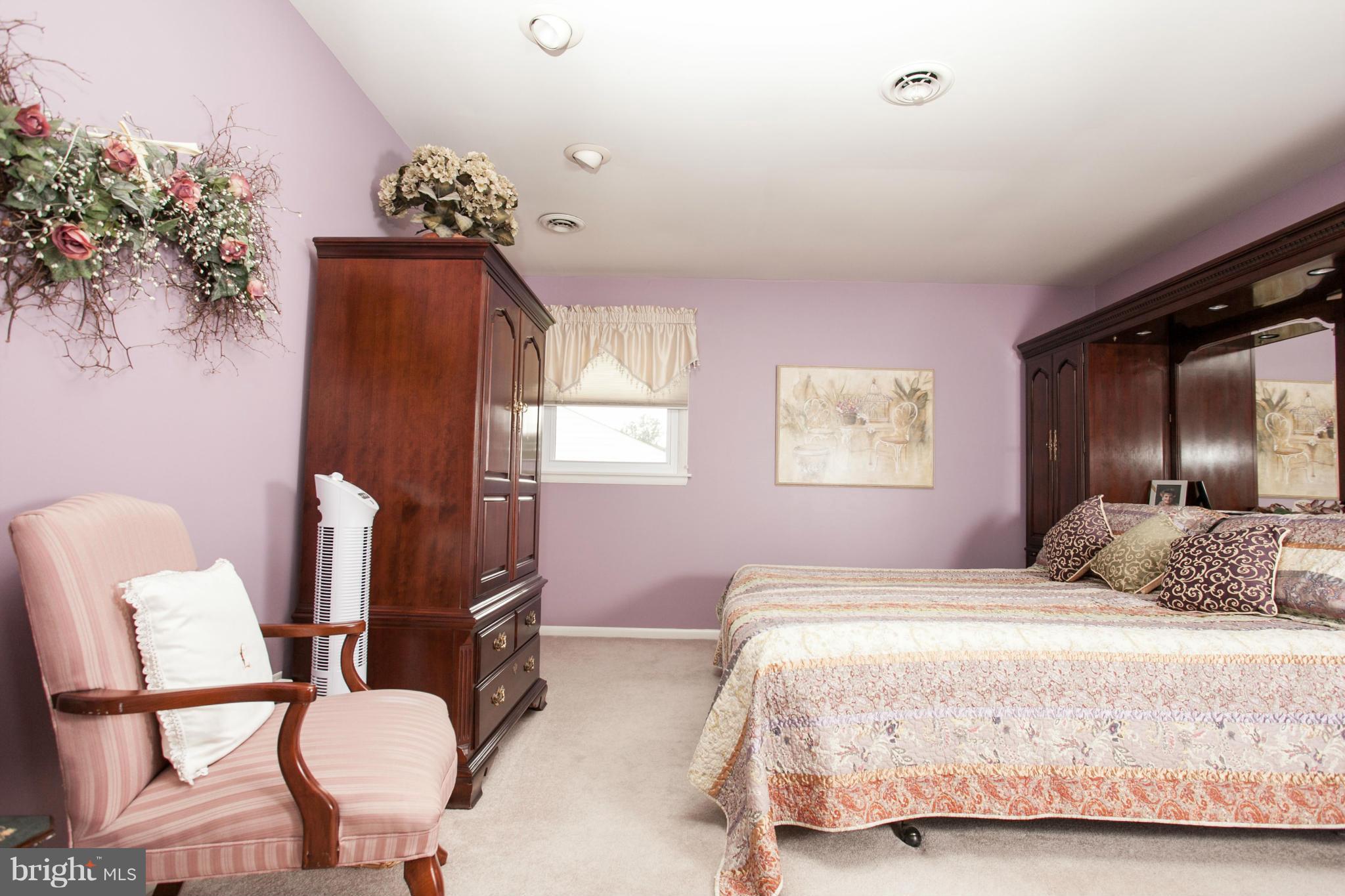 9914 Marilynn Road Perry Hall, MD 21128 - Photo 12 of 25 a bedroom with a bed and dresser