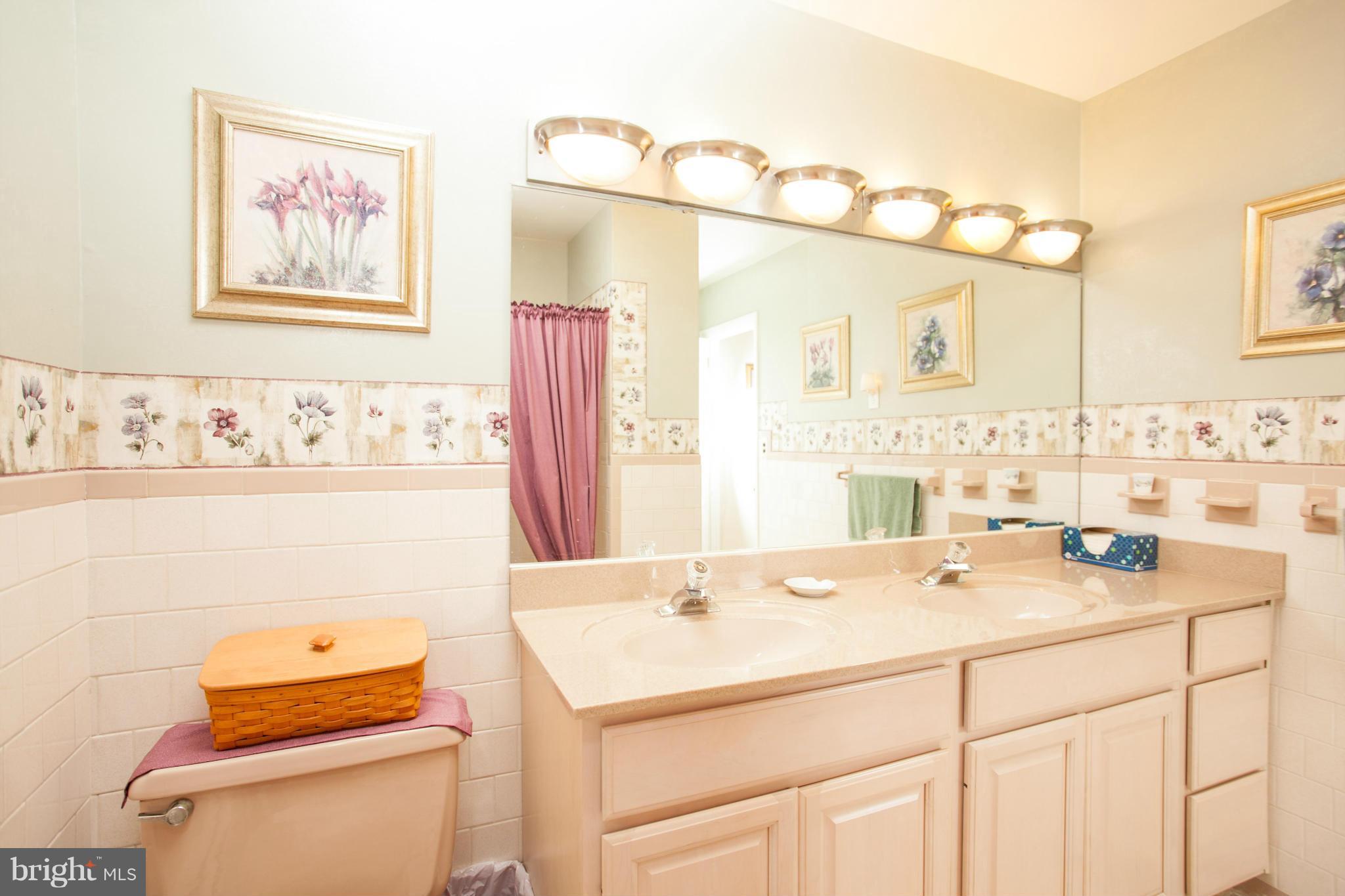 9914 Marilynn Road Perry Hall, MD 21128 - Photo 13 of 25 a bathroom with a sink mirror vanity and toilet