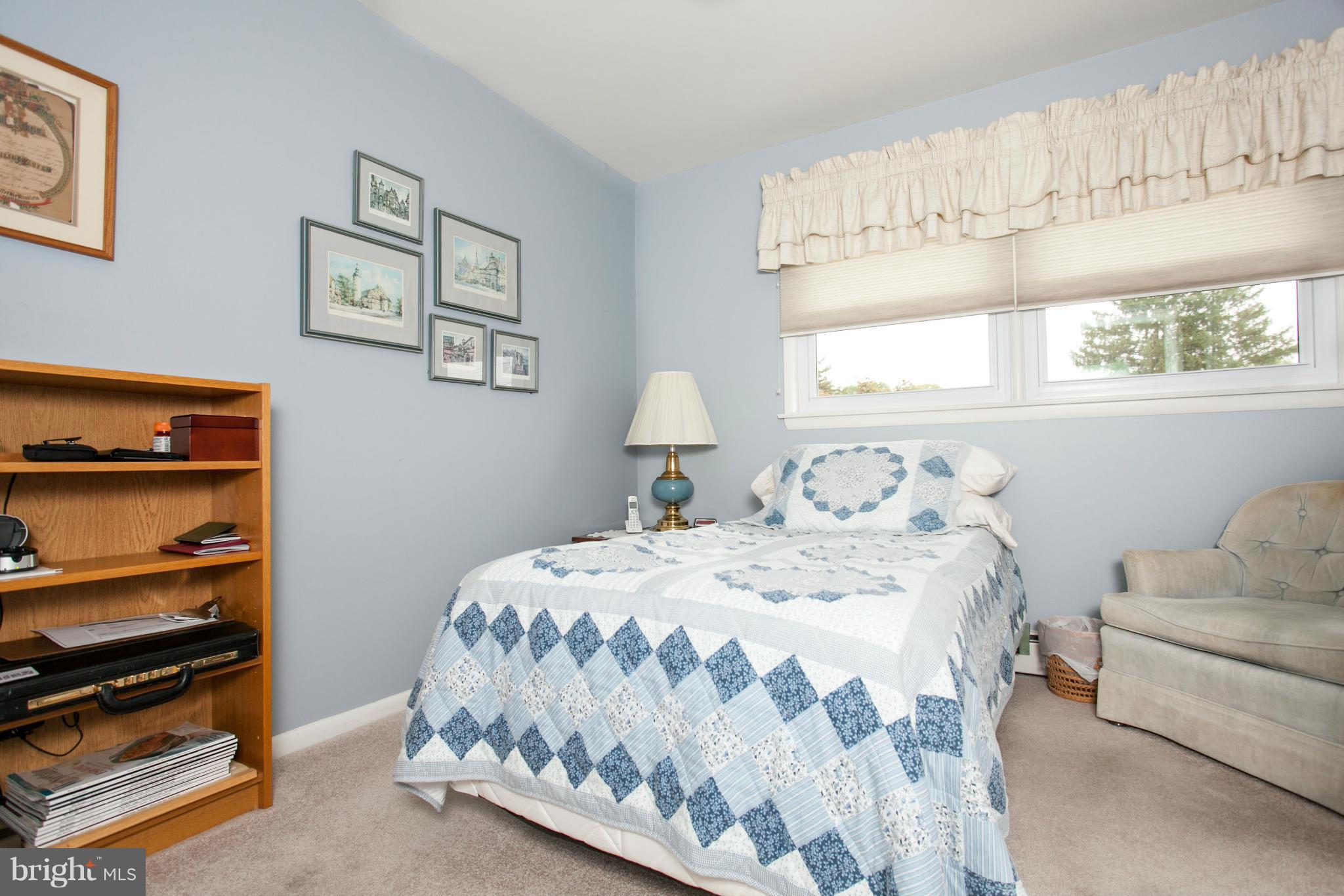9914 Marilynn Road Perry Hall, MD 21128 - Photo 15 of 25 a bedroom with a bed and wooden floor