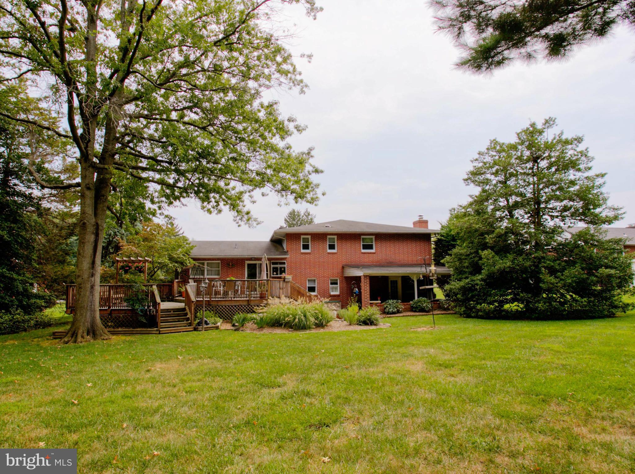 9914 Marilynn Road Perry Hall, MD 21128 - Photo 25 of 25 a view of a house with a big yard potted plants and large tree