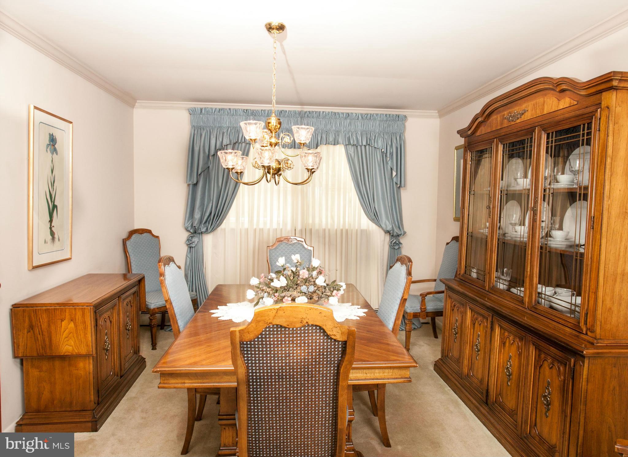 9914 Marilynn Road Perry Hall, MD 21128 - Photo 5 of 25 a view of a dining room with furniture and chandelier