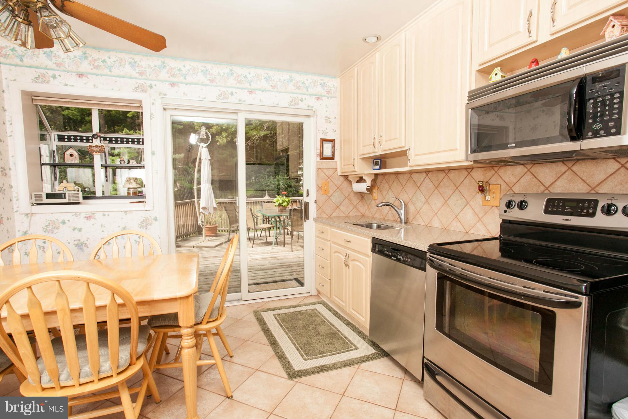 9914 Marilynn Road Perry Hall, MD 21128 - Photo 8 of 25 a kitchen with a stove a sink and a microwave