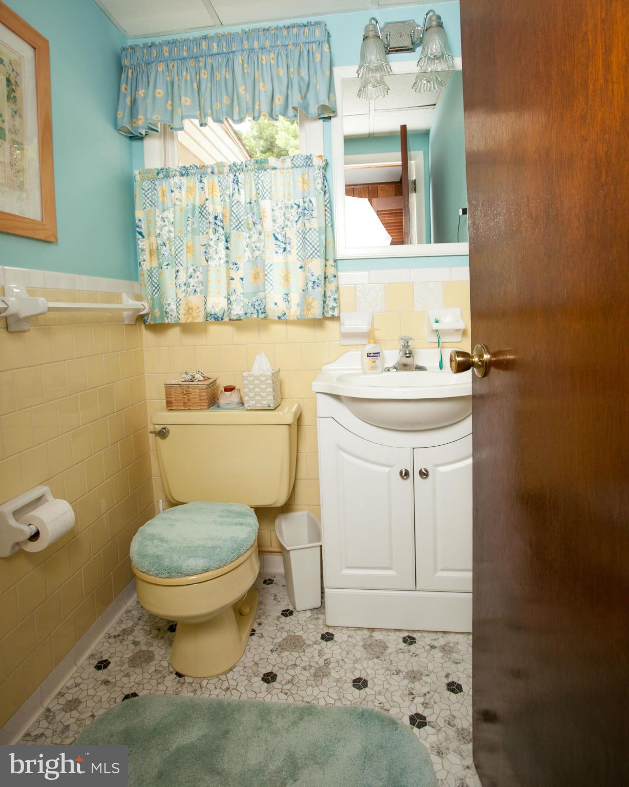 9914 Marilynn Road Perry Hall, MD 21128 - Photo 9 of 25 a bathroom with a sink toilet and window