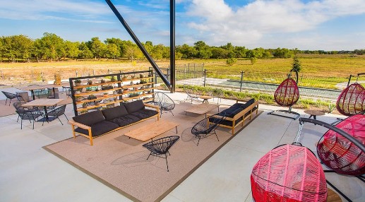 9109 The Ravine Way Austin, TX 78744 - Photo 8 of 13 a view of a terrace with wooden floor and lake view