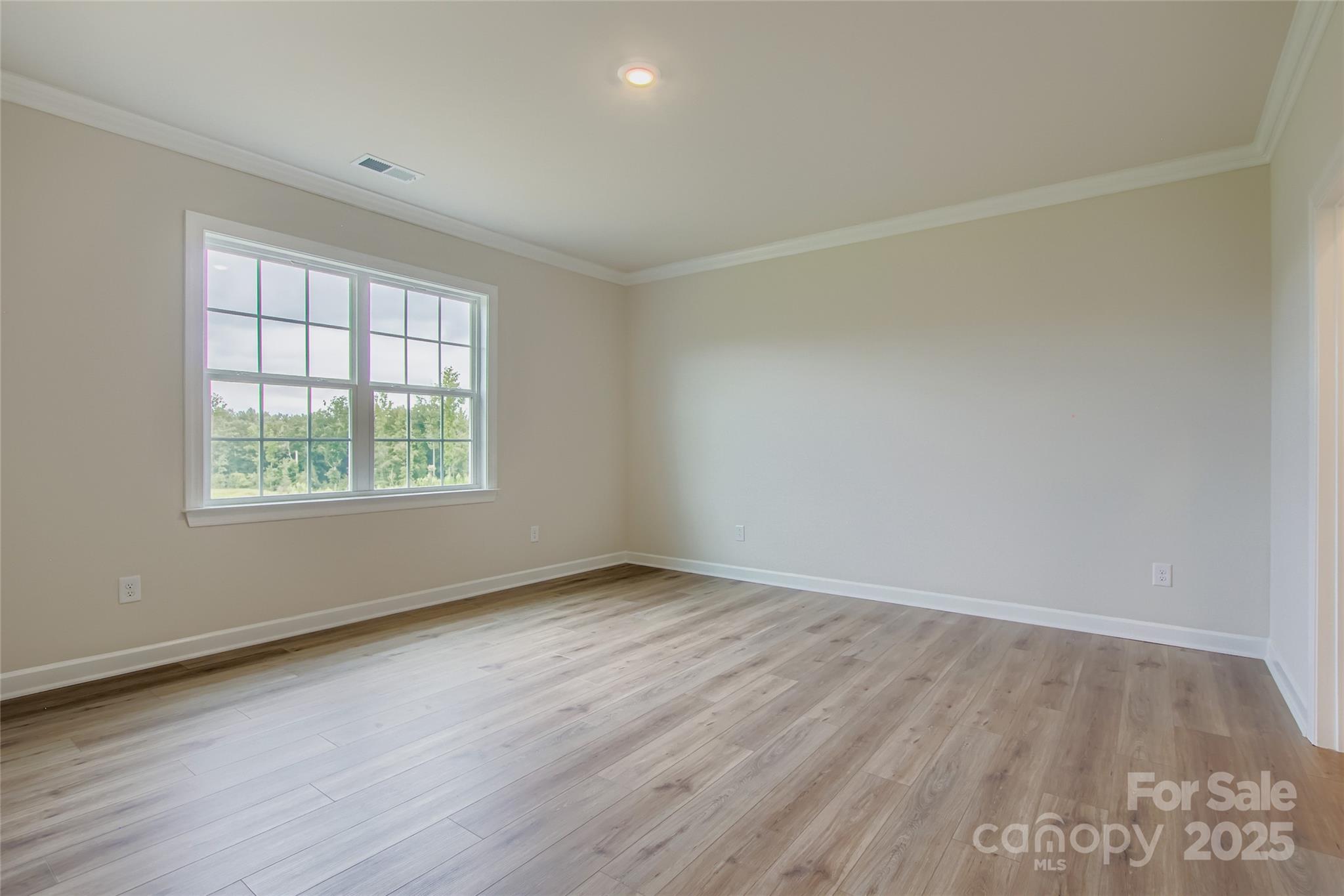 2255 Moon Crst Road, Unit 137 Lancaster, SC 29720 - Photo 5 of 16 an empty room with wooden floor and windows