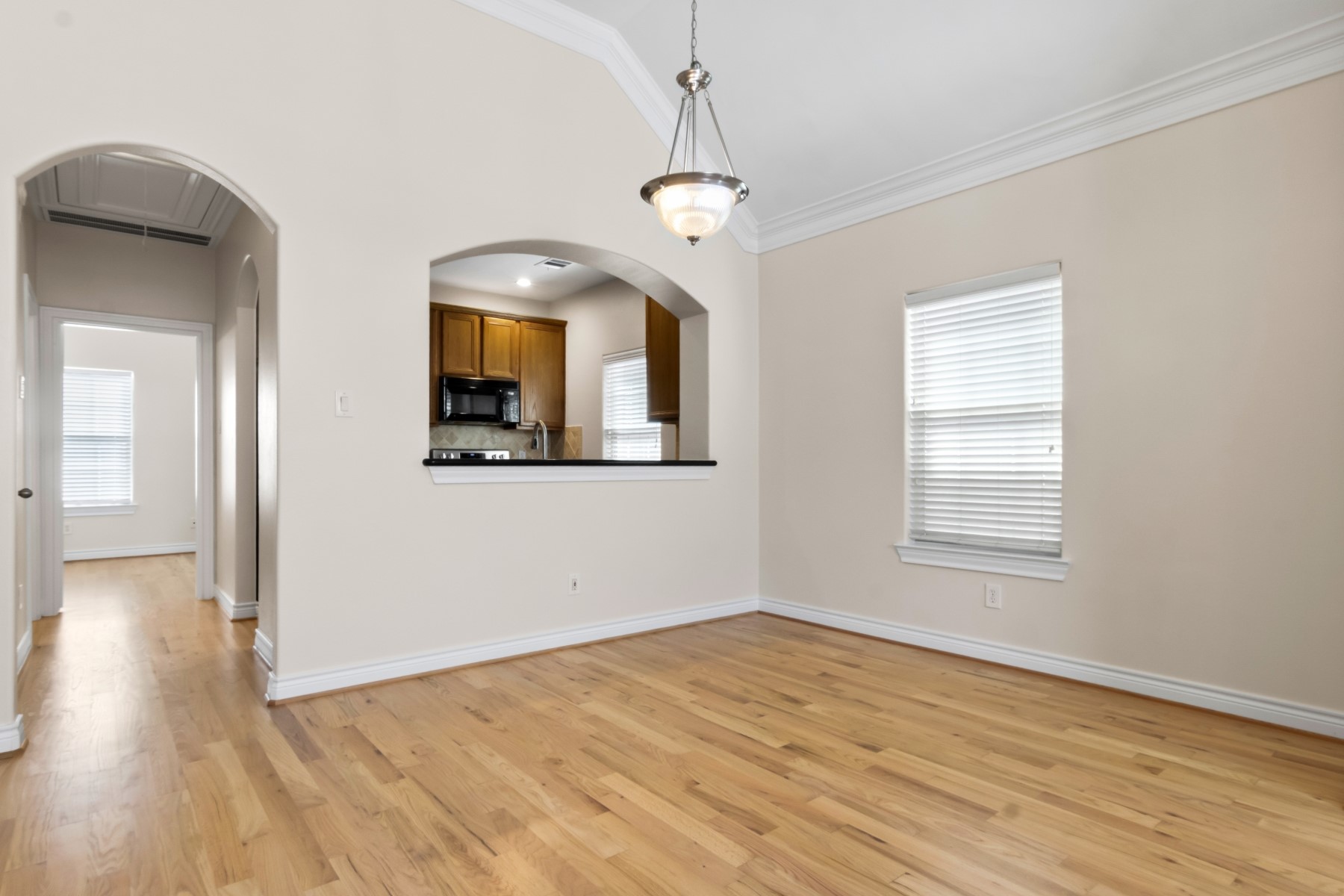 2917 Clinton Drive Houston, TX 77020 - Photo 13 of 24 a view of empty room with wooden floor and fan