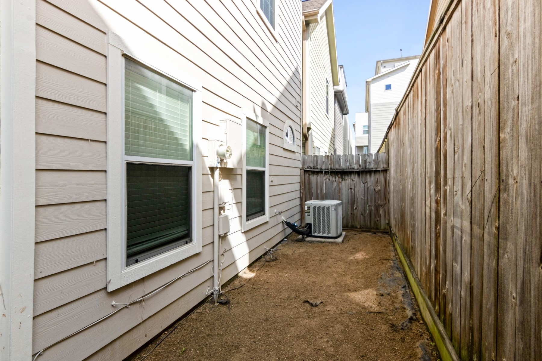 2917 Clinton Drive Houston, TX 77020 - Photo 24 of 24 a view of a house with a door and wooden walls