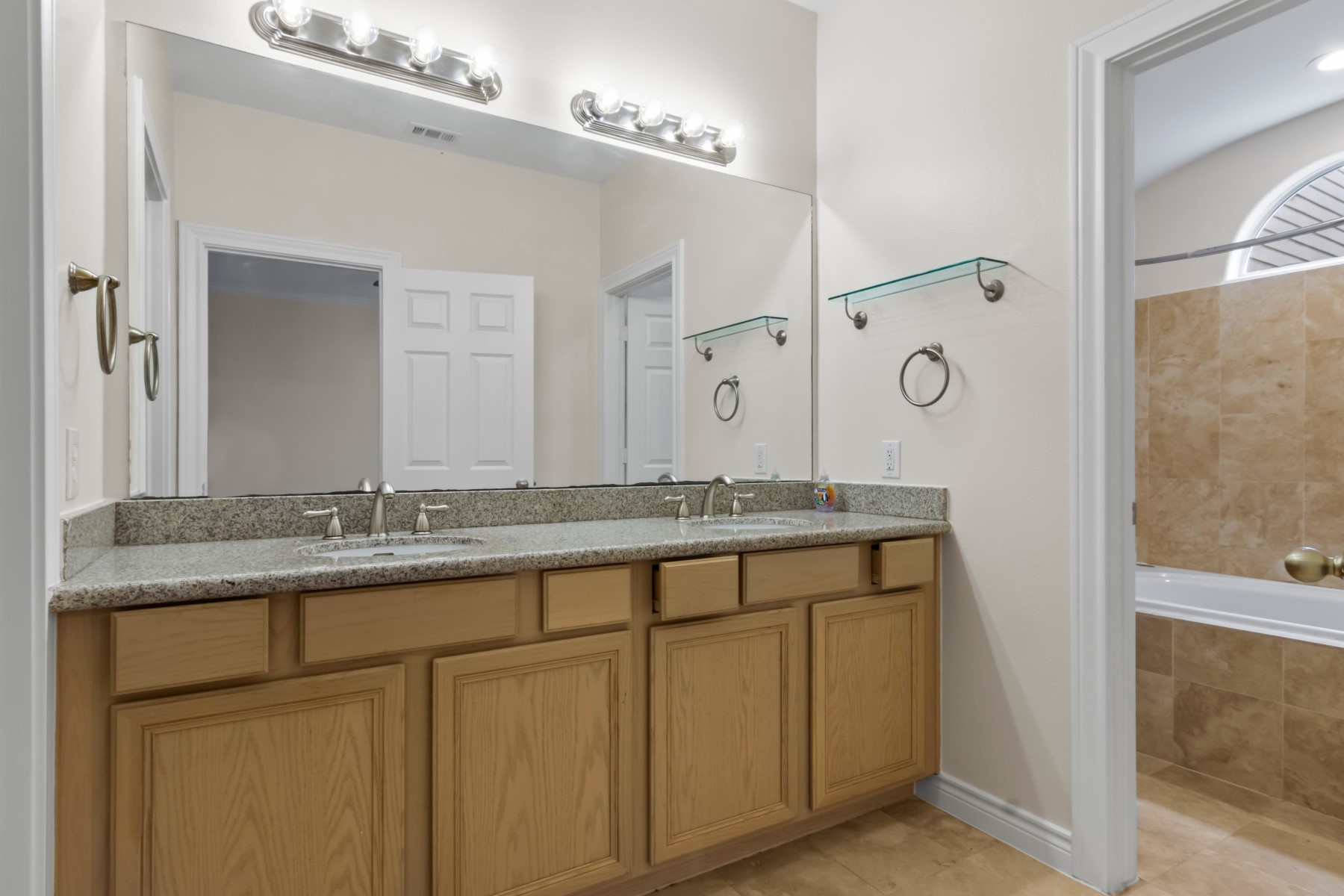 2917 Clinton Drive Houston, TX 77020 - Photo 10 of 24 a bathroom with a granite countertop sink and a mirror