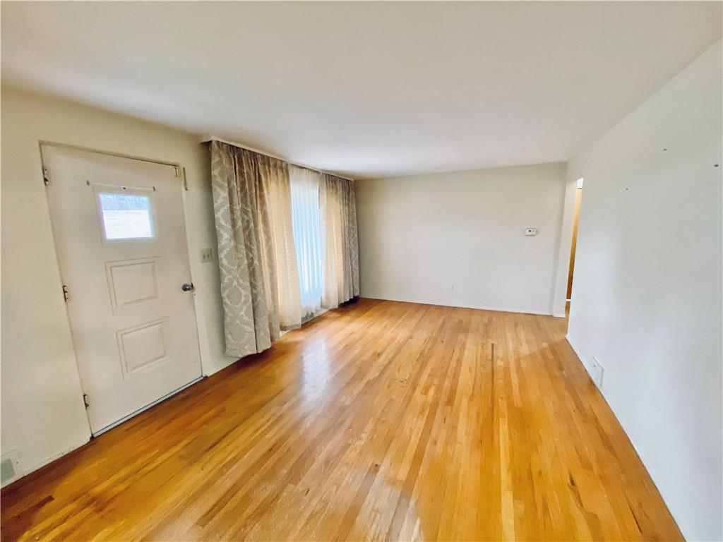 206 Streets Run Road Pittsburgh, PA 15236 - Photo 2 of 22 Living room featuring exposed hardwood floors.