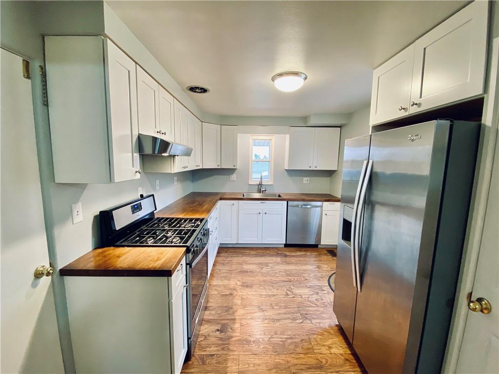 206 Streets Run Road Pittsburgh, PA 15236 - Photo 7 of 22 The kitchen also includes stainless steel appliances.
