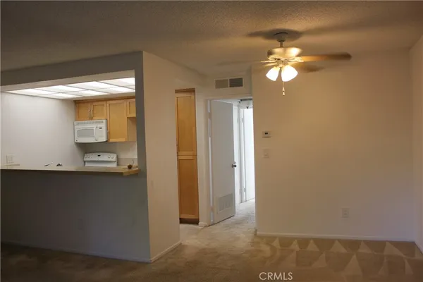 a view of a bathroom with a sink and mirror