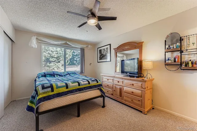 a bedroom with furniture and window