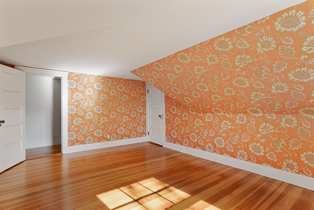 20 Winthrop Road Lexington, MA 02421 - Photo 20 of 33 a view of an empty room with wooden floor and a window