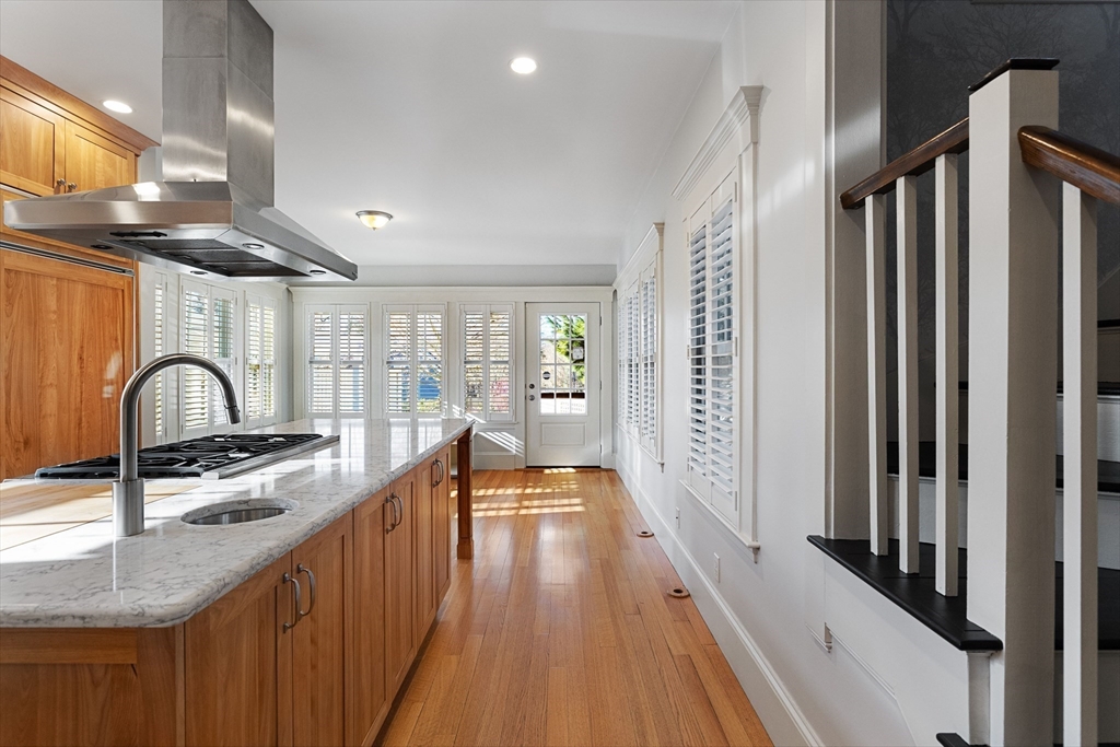 20 Winthrop Road Lexington, MA 02421 - Photo 5 of 33 a view of a kitchen with kitchen island granite countertop a sink and wooden floor