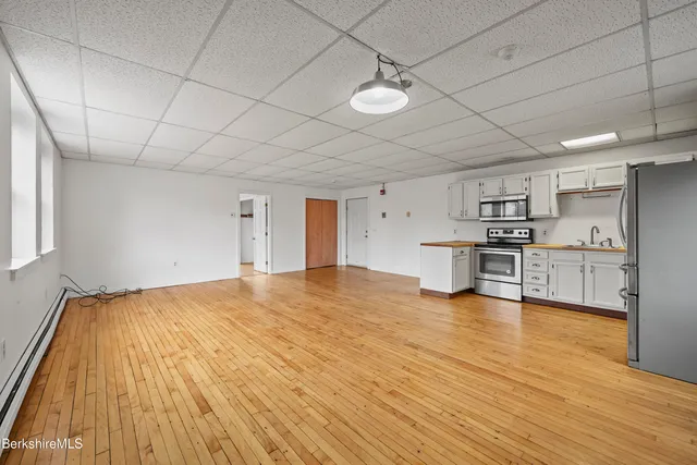 a view of kitchen with wooden floor