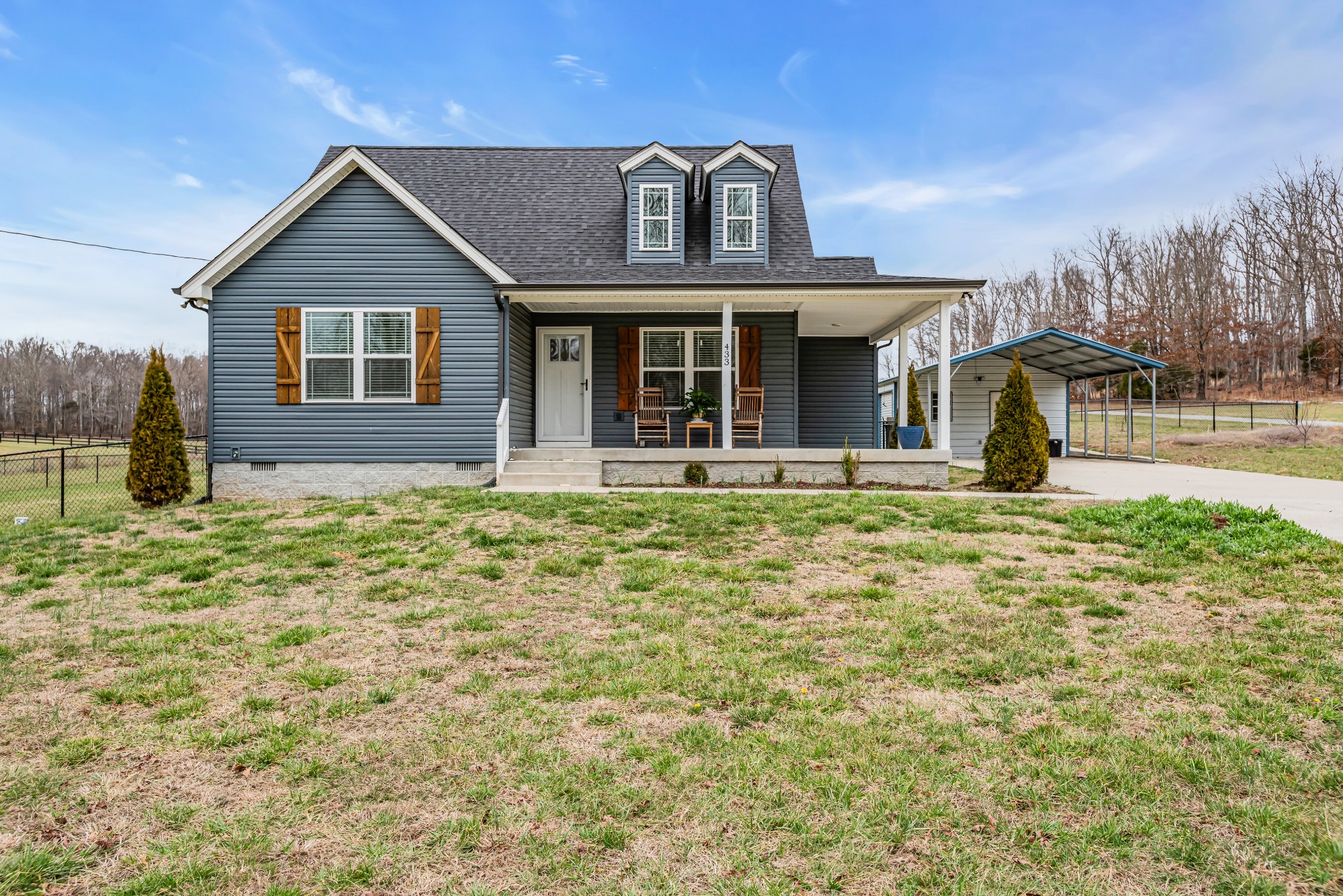 433 Pruett Road Dickson, TN 37055 - Photo 1 of 24 a front view of a house with garden